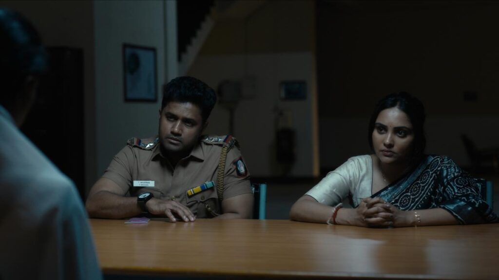 “Stephen move review seated in a police interrogation room with investigators Michael and Seema questioning him in the Tamil Stephen movie review